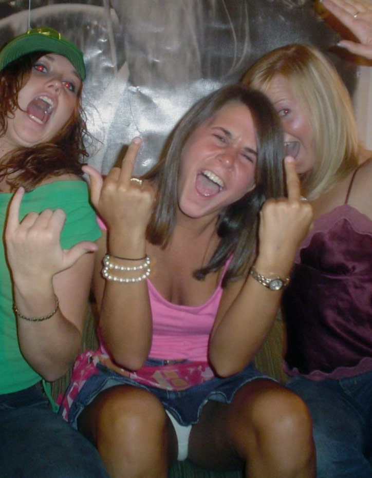 Young female student flipping off the camera